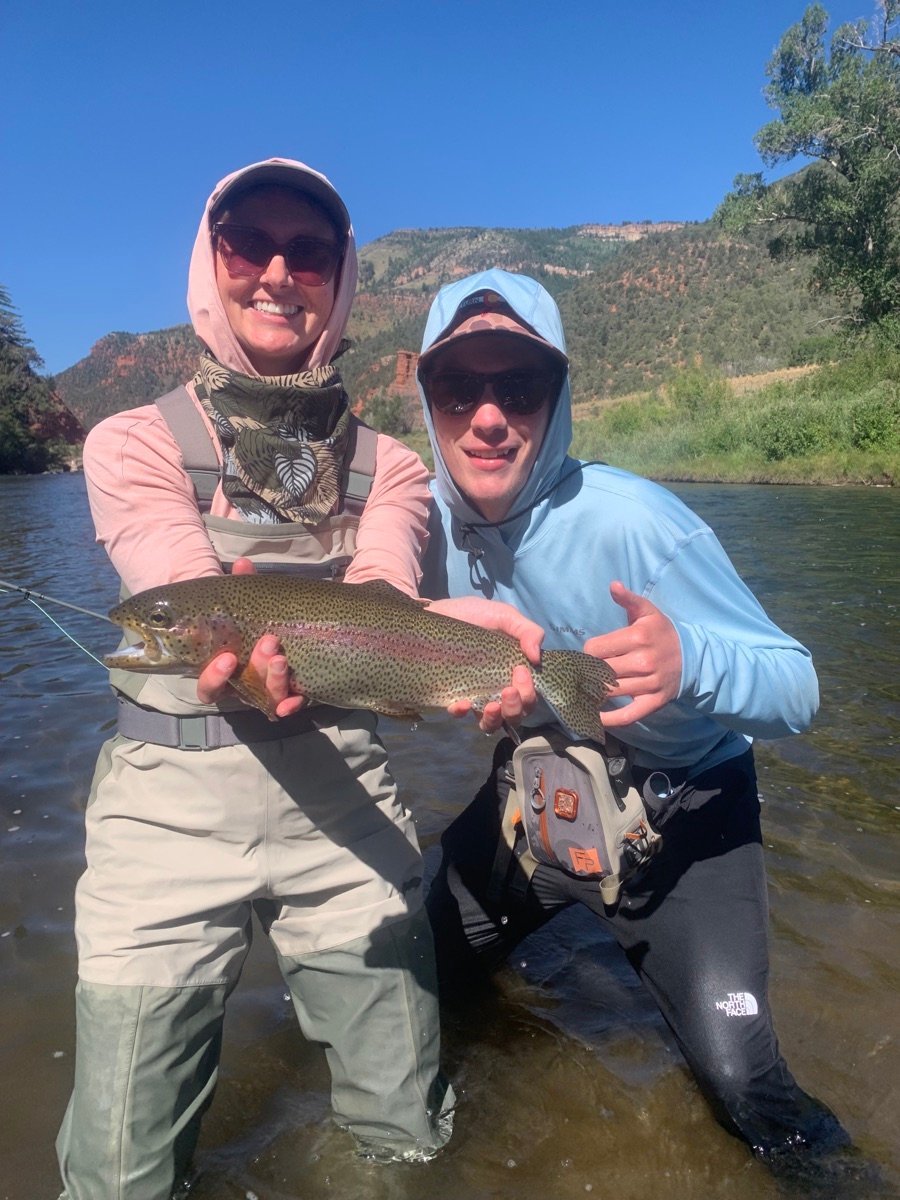 Karsten Anderson, fly fishing guide and author, with a client on the river